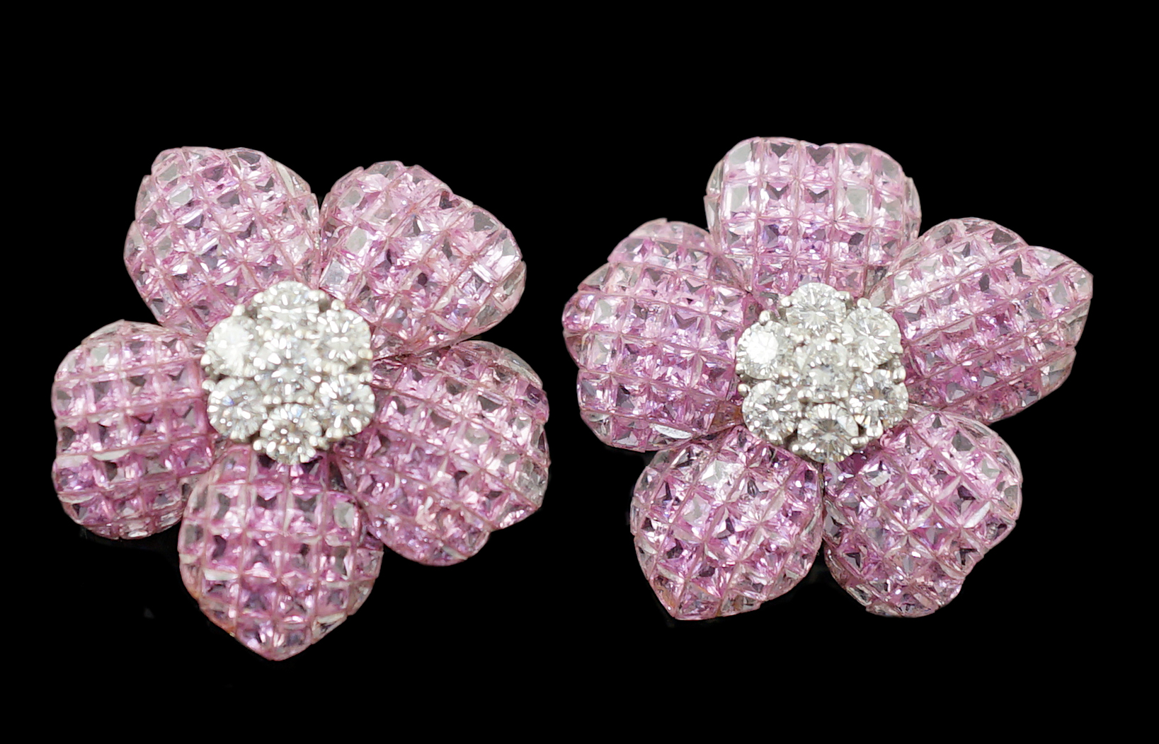 A pair of 18k white gold, pink sapphire and diamond cluster set flower head ear clips/earrings
